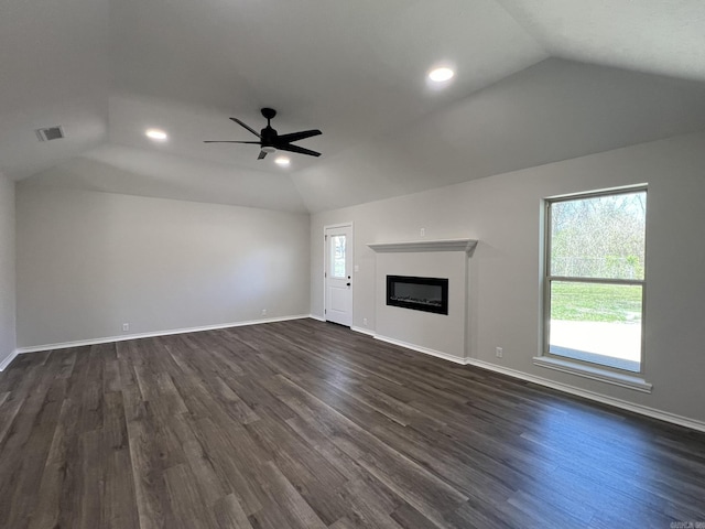 unfurnished living room featuring a ceiling fan, visible vents, vaulted ceiling, and dark wood-style flooring