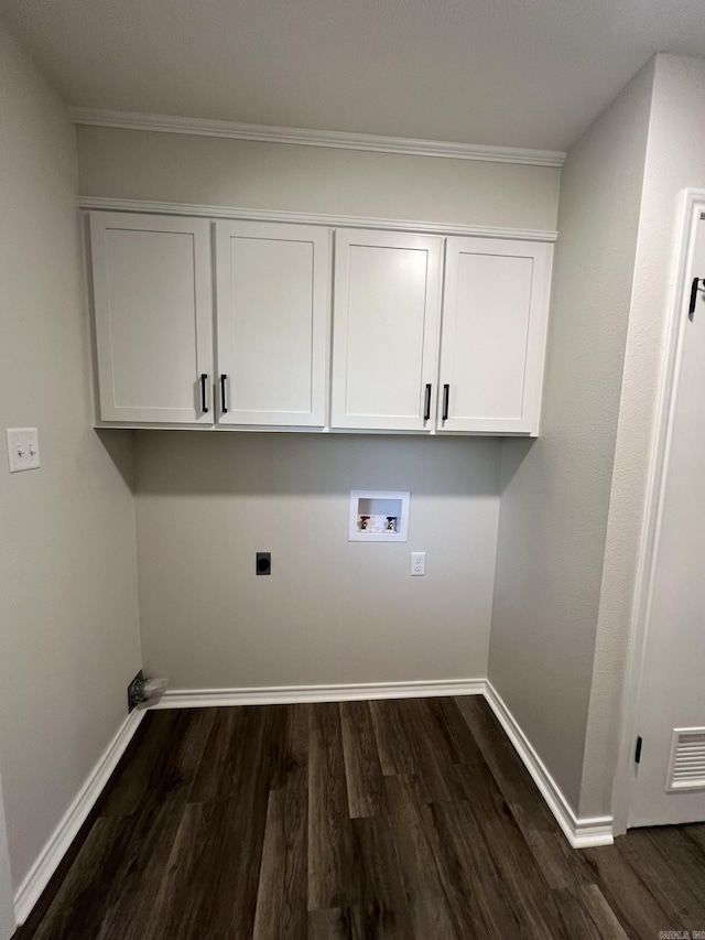 laundry room with electric dryer hookup, washer hookup, visible vents, and dark wood-type flooring