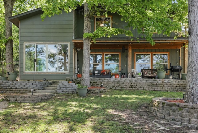 rear view of house with a lawn