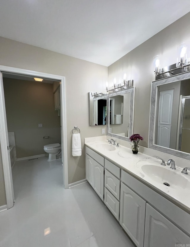 full bath with baseboards, a sink, visible vents, and double vanity