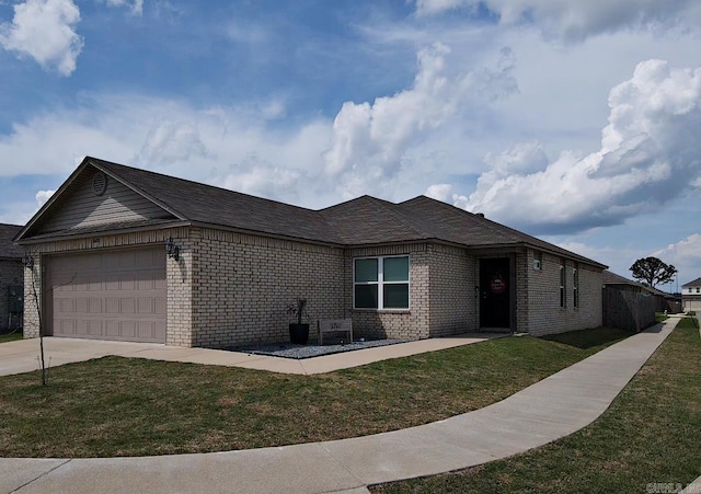 view of front of property with driveway, a front yard, brick siding, and a garage