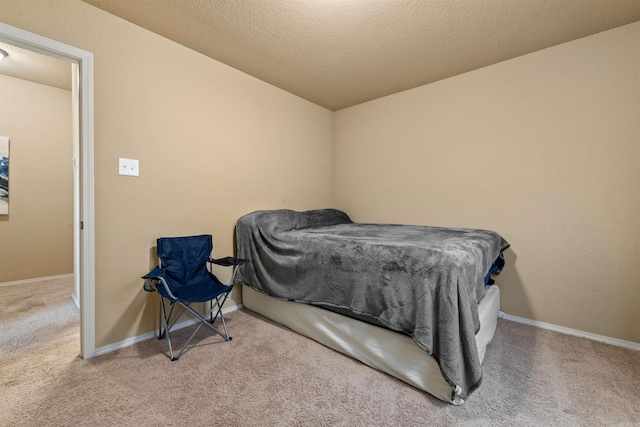 carpeted bedroom with baseboards