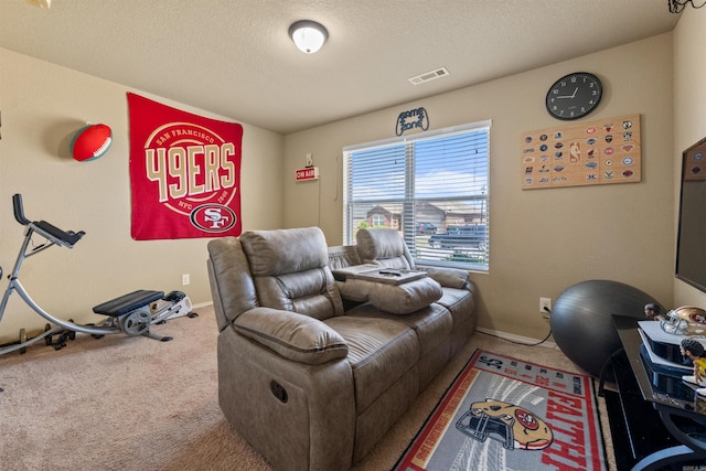 living area with baseboards, visible vents, a textured ceiling, and carpet flooring