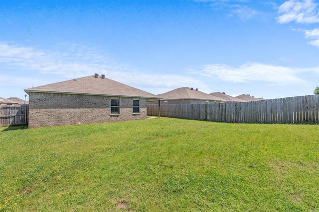 view of yard featuring a fenced backyard