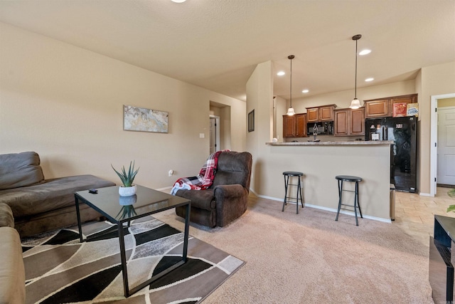 living room featuring recessed lighting, light carpet, and baseboards