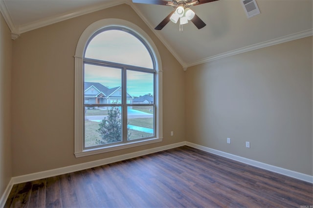 spare room with lofted ceiling, crown molding, visible vents, ceiling fan, and dark wood-style flooring