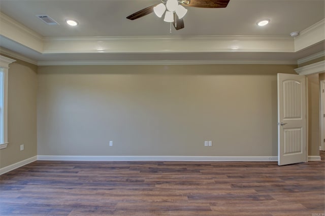 spare room with visible vents, a raised ceiling, a ceiling fan, and ornamental molding