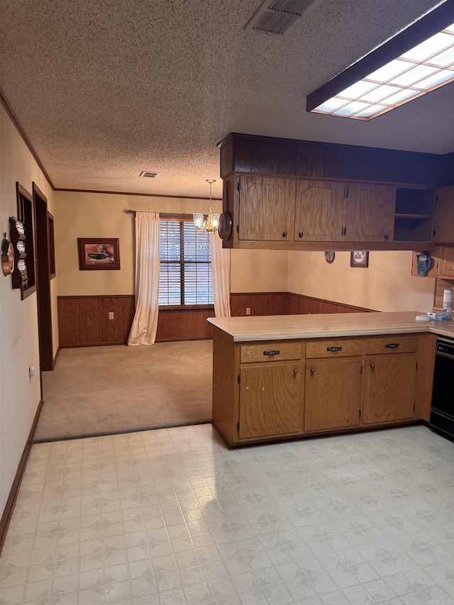 1721 Azalea Hills Rd, White Hall, AR 71602 - kitchen featuring a chandelier, a textured ceiling, light countertops, light flooring, and wainscoting