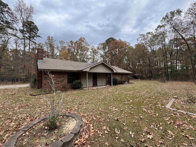 1721 Azalea Hills Rd, White Hall, AR 71602 - view of front of house with a chimney and a front lawn