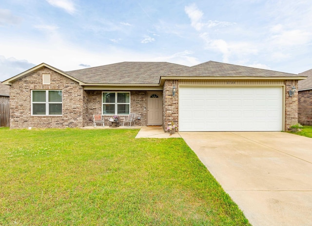 ranch-style home with brick siding, a front lawn, driveway, and an attached garage