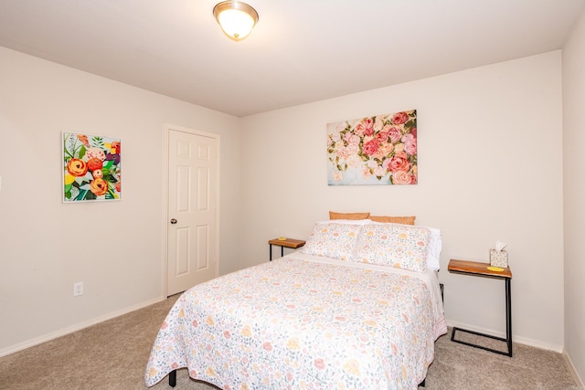 bedroom featuring carpet flooring and baseboards