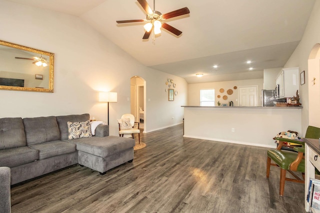 living room with dark wood finished floors, recessed lighting, arched walkways, ceiling fan, and high vaulted ceiling