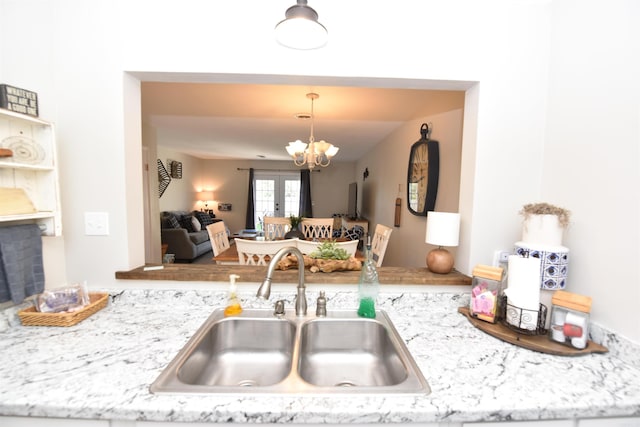 135 Hillview Dr Unit 109, Fairfield Bay, AR 72088 - kitchen featuring a sink, a chandelier, and pendant lighting