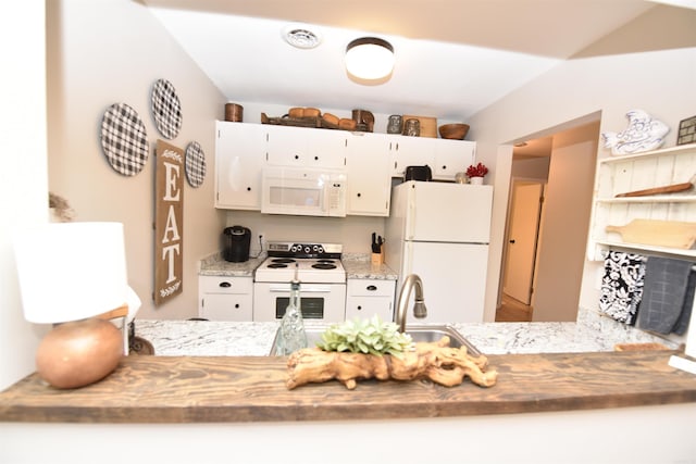 135 Hillview Dr Unit 109, Fairfield Bay, AR 72088 - kitchen with a sink, open shelves, a peninsula, white appliances, and white cabinets