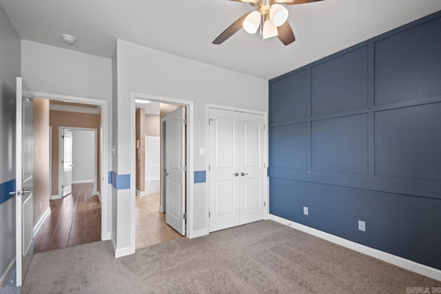 2360 Lakeshore Ln, Cabot, AR 72023 - unfurnished bedroom with a closet, baseboards, a ceiling fan, and carpet floors