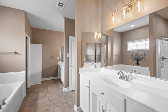 2360 Lakeshore Ln, Cabot, AR 72023 - bathroom featuring tile patterned floors, visible vents, a garden tub, and vanity