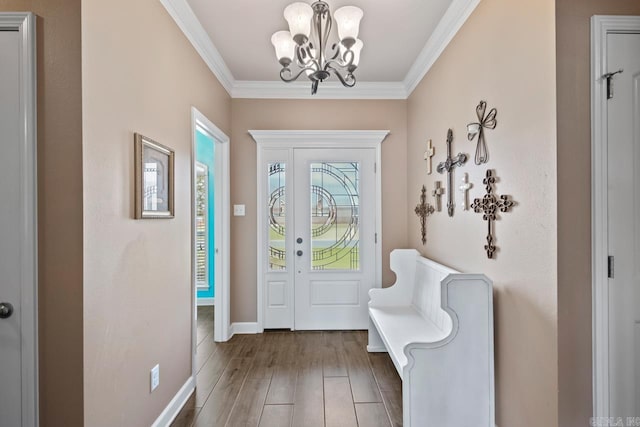 2360 Lakeshore Ln, Cabot, AR 72023 - foyer featuring wood finished floors, crown molding, a notable chandelier, and baseboards