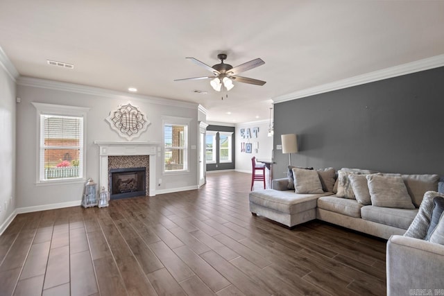 2360 Lakeshore Ln, Cabot, AR 72023 - living area with a fireplace, ceiling fan, crown molding, visible vents, and baseboards