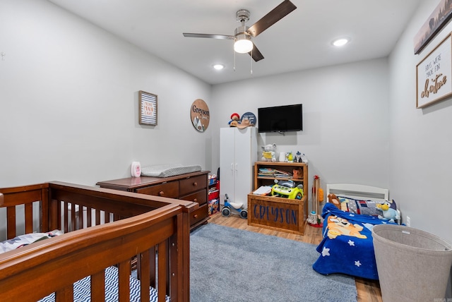 bedroom featuring recessed lighting, wood finished floors, and ceiling fan
