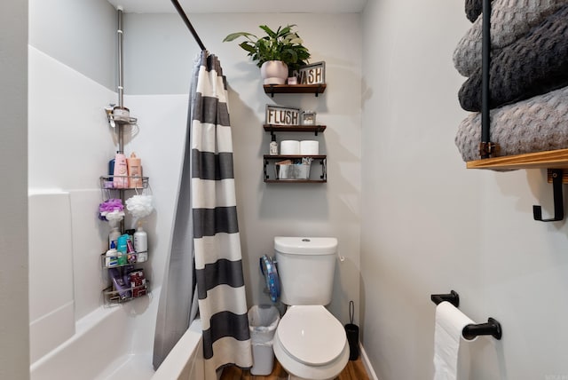 bathroom featuring toilet and shower / bath combo