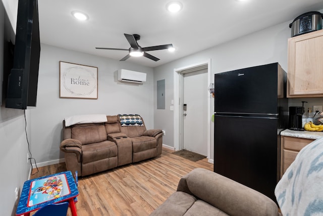 living room with light wood-style flooring, ceiling fan, electric panel, recessed lighting, and an AC wall unit