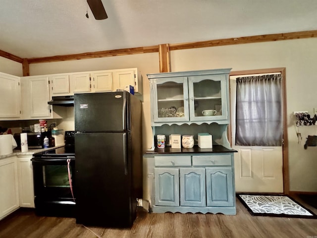 kitchen with dark wood-style flooring, glass insert cabinets, black appliances, a ceiling fan, and white cabinets