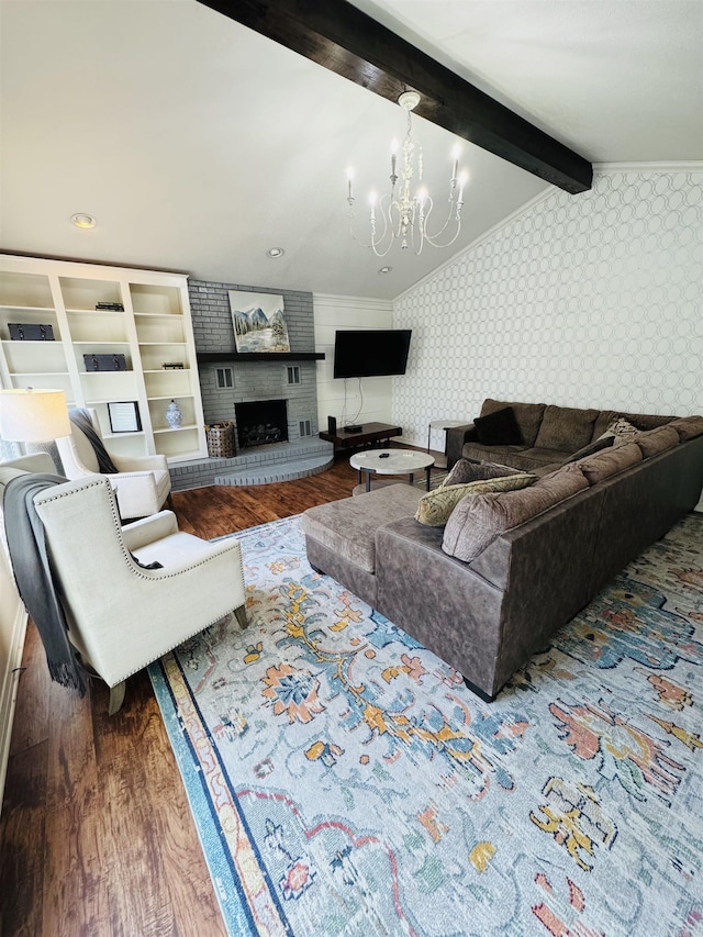22 Azalea, Magnolia, AR 71753 - living area with an inviting chandelier, beam ceiling, a brick fireplace, wallpapered walls, and wood finished floors