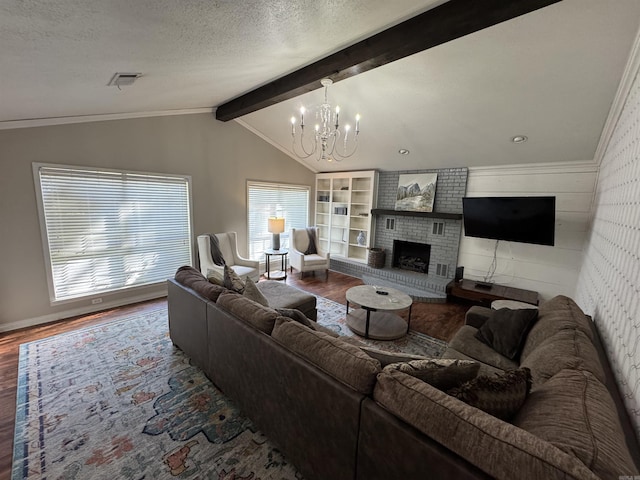 22 Azalea, Magnolia, AR 71753 - living area featuring a chandelier, vaulted ceiling with beams, visible vents, a textured ceiling, and wood finished floors