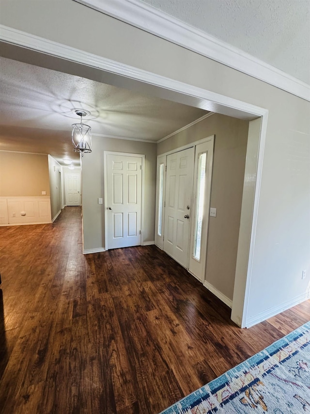 22 Azalea, Magnolia, AR 71753 - entryway featuring baseboards, a textured ceiling, and dark wood-type flooring