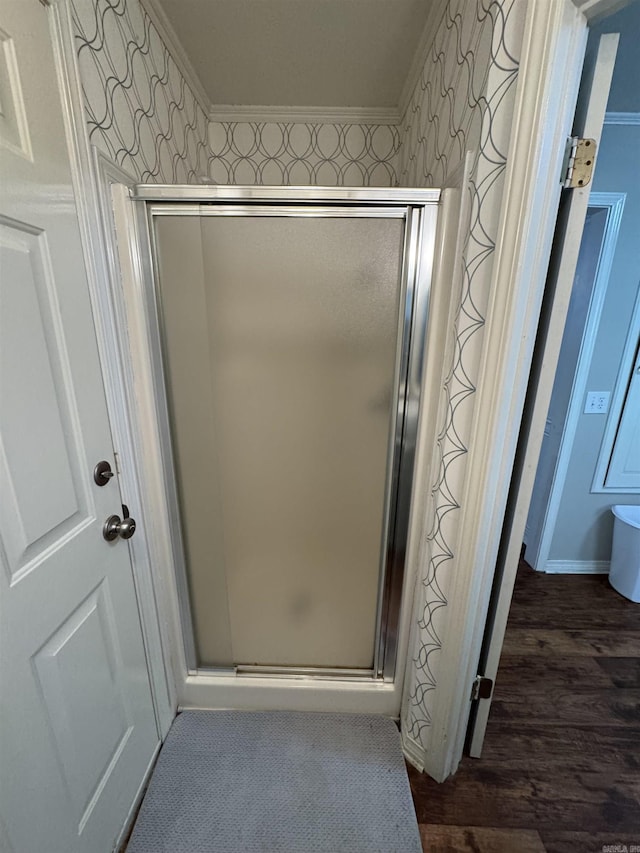 22 Azalea, Magnolia, AR 71753 - full bathroom with wood finished floors, wallpapered walls, crown molding, and a stall shower