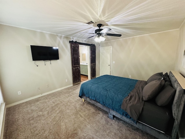 22 Azalea, Magnolia, AR 71753 - bedroom featuring carpet flooring, a barn door, visible vents, baseboards, and ornamental molding