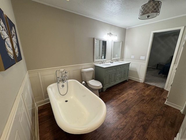 22 Azalea, Magnolia, AR 71753 - full bath with a soaking tub, a textured ceiling, a decorative wall, and a sink