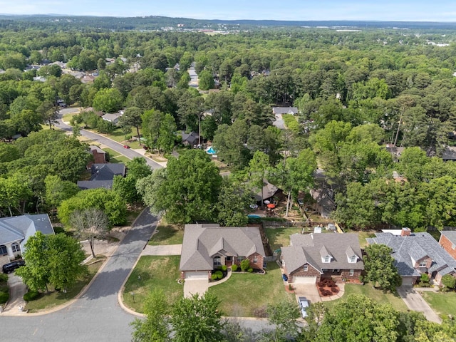 aerial view with a residential view and a wooded view