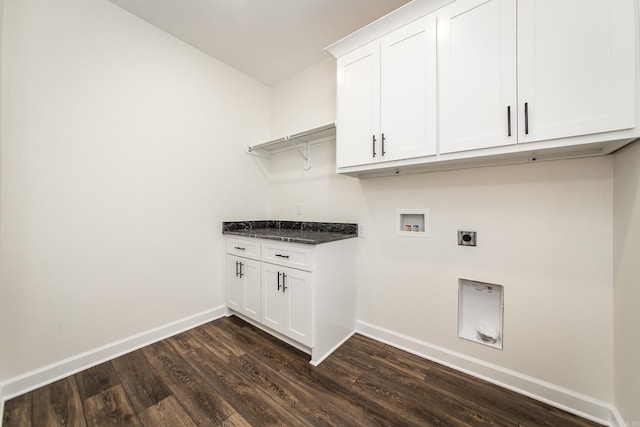 washroom with hookup for a washing machine, electric dryer hookup, cabinet space, baseboards, and dark wood-style floors