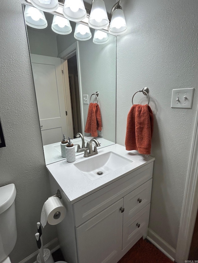half bath with toilet and vanity