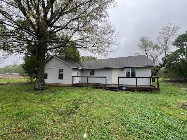 12326 Renshaw Ln, Trumann, AR 72401 - rear view of house with a deck and a yard