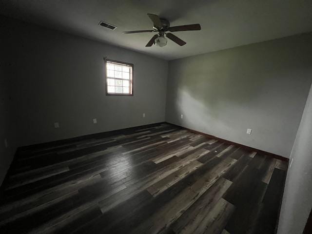 12326 Renshaw Ln, Trumann, AR 72401 - spare room with dark wood finished floors, visible vents, and a ceiling fan