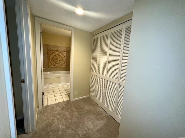 142 Lake Hamilton Dr Unit 204, Hot Springs, AR 71913 - hall featuring tile patterned floors, baseboards, and carpet floors