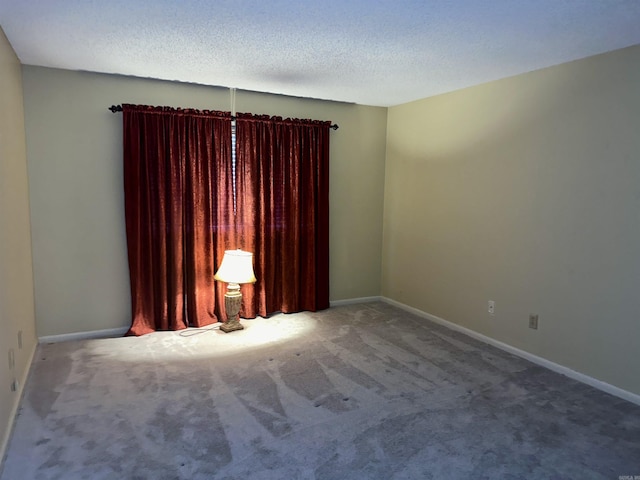 142 Lake Hamilton Dr Unit 204, Hot Springs, AR 71913 - spare room featuring baseboards, a textured ceiling, and carpet