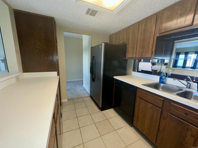 142 Lake Hamilton Dr Unit 204, Hot Springs, AR 71913 - kitchen with light tile patterned floors, black dishwasher, light countertops, a sink, and visible vents