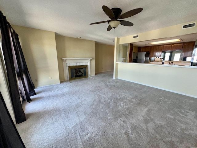 142 Lake Hamilton Dr Unit 204, Hot Springs, AR 71913 - unfurnished living room with a textured ceiling, visible vents, ceiling fan, and light carpet
