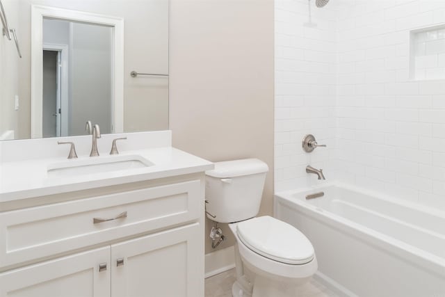 bathroom with washtub / shower combination, vanity, and toilet