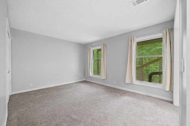 73 Perralena Way, Hot Springs Village, AR 71909 - unfurnished room featuring visible vents, carpet floors, and a textured ceiling
