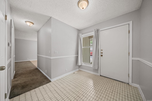 73 Perralena Way, Hot Springs Village, AR 71909 - entryway with a textured ceiling, visible vents, and baseboards