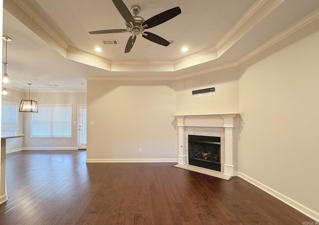 15315 Governors Lake Ave, Little Rock, AR 72223 - unfurnished living room with crown molding, a raised ceiling, ceiling fan, dark wood finished floors, and a premium fireplace