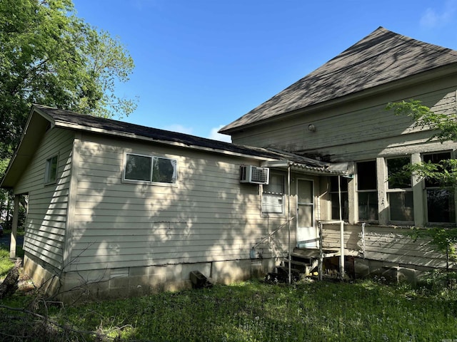 307 E Center Ave, Searcy, AR 72143 - view of side of property featuring crawl space and a wall unit AC