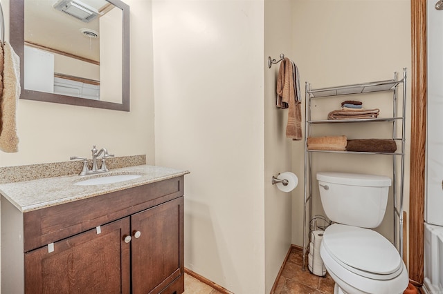 bathroom featuring baseboards, visible vents, toilet, and vanity
