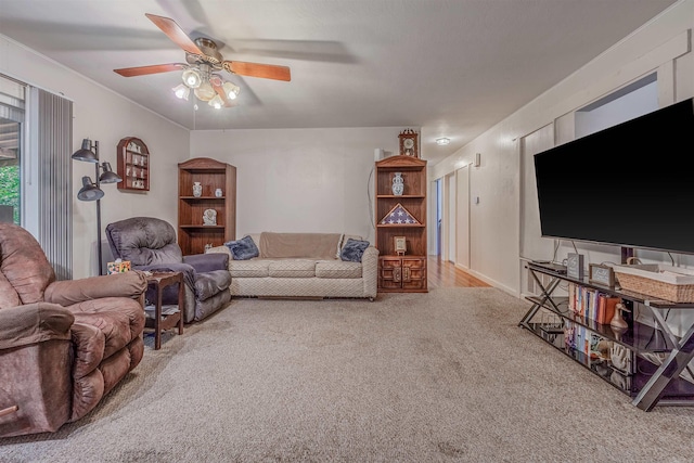 living room with carpet and a ceiling fan