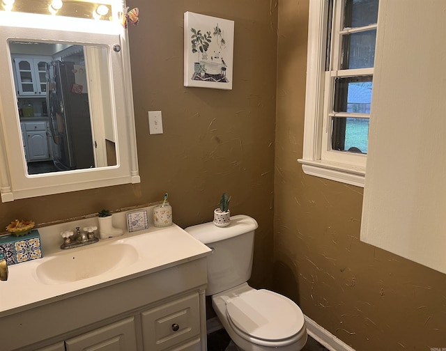 190 E Poplar St, Piggott, AR 72454 - half bathroom with toilet and vanity
