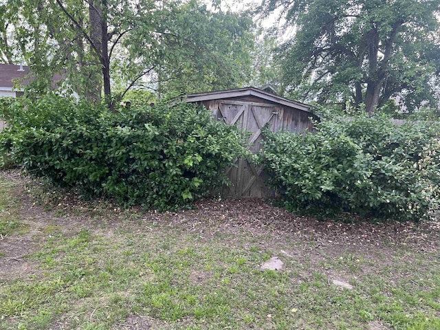 190 E Poplar St, Piggott, AR 72454 - view of yard with an outbuilding and a storage shed